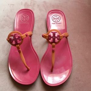 Pink and orange jelly sandals.